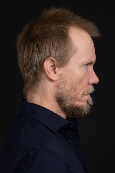 Matti Boustedt, profile portrait in navy shirt