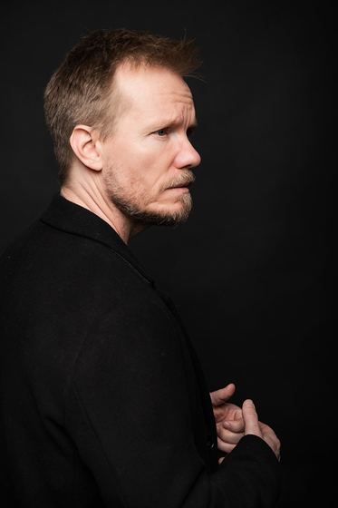 Matti Boustedt, side profile studio portrait, looking over shoulder