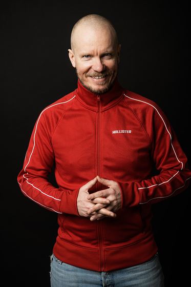 Matti Boustedt, character portrait with shaved head, red jacket